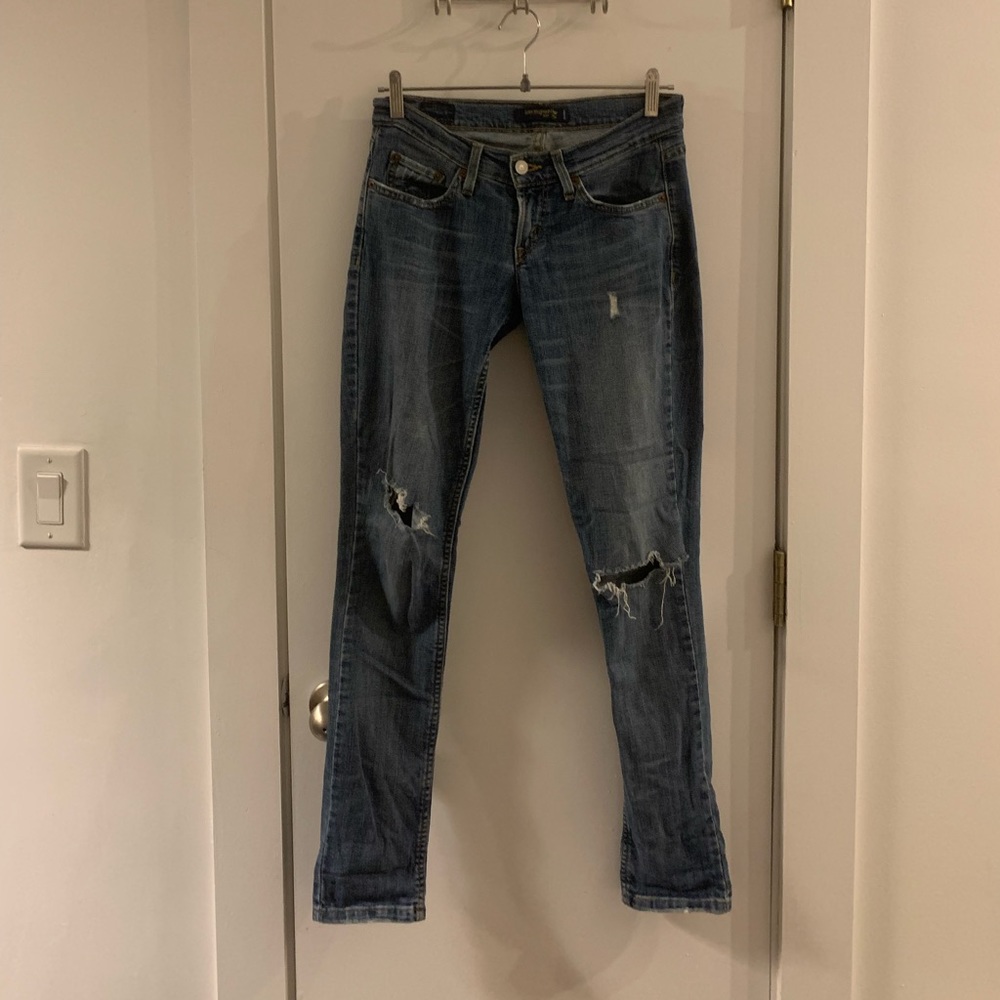 Super trendy super low rise distressed Levi jeans